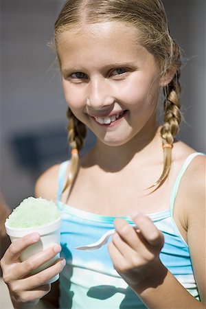 snow cone - Girl eating slushy Stock Photo - Premium Royalty-Free, Code: 640-01354876