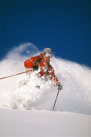 simsearch:640-01362181,k - Downhill skier skiing on mountain Foto de stock - Sin royalties Premium, Código: 640-01354913