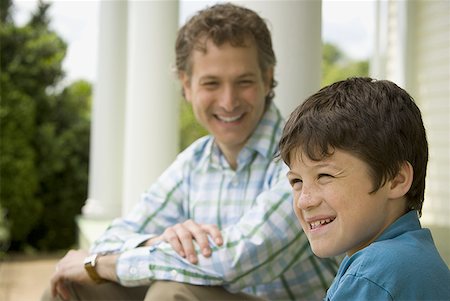 simsearch:614-07194702,k - Close-up of a boy and his father smiling Stock Photo - Premium Royalty-Free, Code: 640-01354990