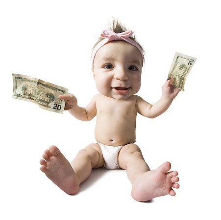 Caricature of baby girl sitting and holding US twenty dollar bills Stock Photo - Premium Royalty-Free, Code: 640-01355024