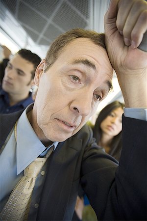 Close-up of a man traveling on a passenger train Foto de stock - Sin royalties Premium, Código: 640-01355121