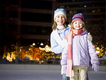 simsearch:640-01601334,k - Two girls outdoors in winter smiling Stock Photo - Premium Royalty-Free, Code: 640-01355132