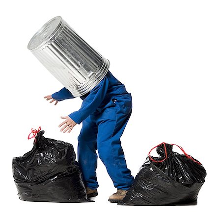 Garbage man with trash can on head Stock Photo - Premium Royalty-Free, Code: 640-01355147