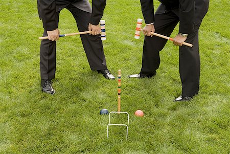 Two businessmen playing croquet Stock Photo - Premium Royalty-Free, Code: 640-01355157