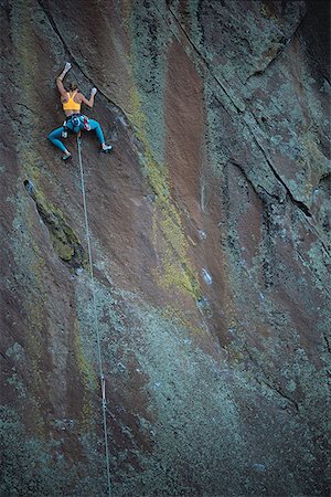 simsearch:640-01349855,k - Low angle view of a person rock climbing Foto de stock - Sin royalties Premium, Código: 640-01355194