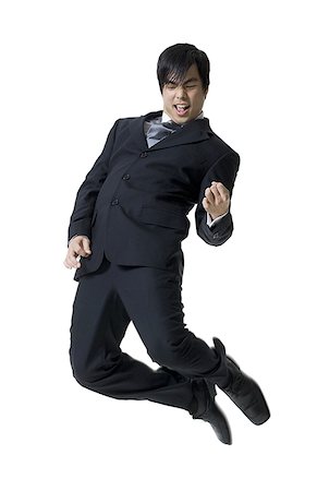 simsearch:640-01360385,k - Businessman jumping in mid-air Stock Photo - Premium Royalty-Free, Code: 640-01355280
