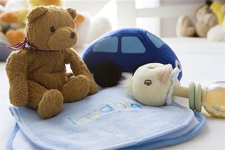 family and new car - Close-up of some baby toys Stock Photo - Premium Royalty-Free, Code: 640-01355314