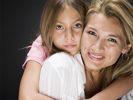 Portrait of a daughter hugging her mother Stock Photo - Premium Royalty-Free, Code: 640-01355328