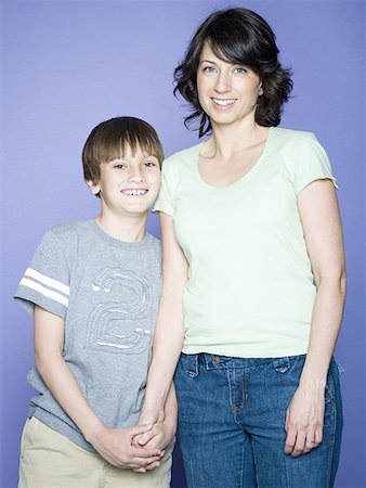 small boy with mature mom - Portrait of a boy standing with his mother Stock Photo - Premium Royalty-Free, Code: 640-01355323