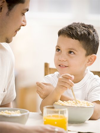 dad dining - Father and young son having breakfast together Stock Photo - Premium Royalty-Free, Code: 640-01355453