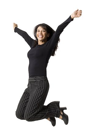 simsearch:640-01358649,k - Portrait of a mid adult woman jumping Fotografie stock - Premium Royalty-Free, Codice: 640-01355467