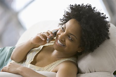 simsearch:640-01353774,k - Close-up of a young woman talking on a mobile phone Stock Photo - Premium Royalty-Free, Code: 640-01355496