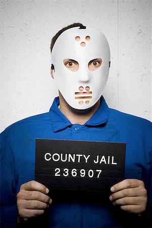 simsearch:640-01358226,k - Mug shot of man with hockey mask Foto de stock - Sin royalties Premium, Código: 640-01355601