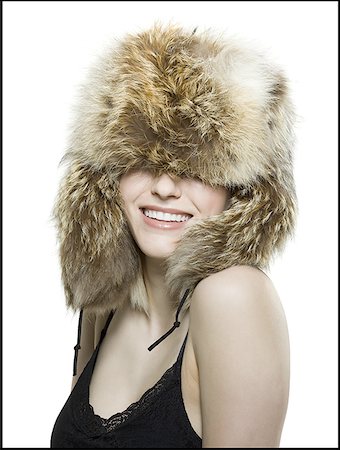 Close-up of a young woman wearing a fur hat Stock Photo - Premium Royalty-Free, Code: 640-01355665