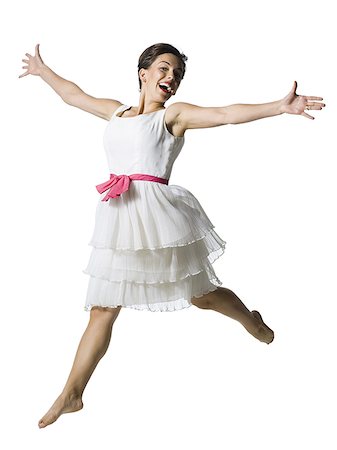 simsearch:640-01355807,k - Woman in white dress jumping Foto de stock - Sin royalties Premium, Código: 640-01355669