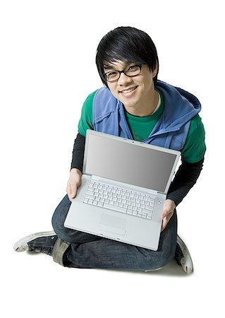 simsearch:640-01355807,k - Man with laptop sitting cross legged smiling Stock Photo - Premium Royalty-Free, Code: 640-01355726