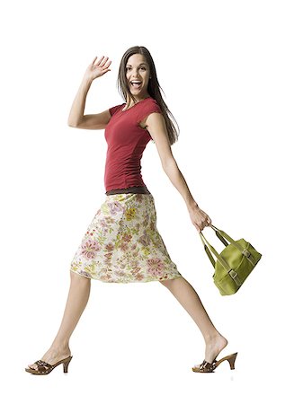 purse full body white background - Portrait of a woman walking with a purse Stock Photo - Premium Royalty-Free, Code: 640-01355745