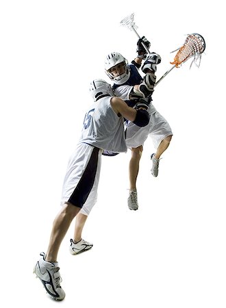 simsearch:625-00838657,k - Two young men playing lacrosse Stock Photo - Premium Royalty-Free, Code: 640-01355764