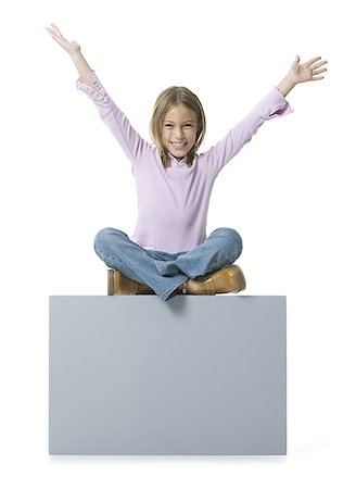 Portrait of a girl sitting on a blank sign Stock Photo - Premium Royalty-Free, Code: 640-01355775