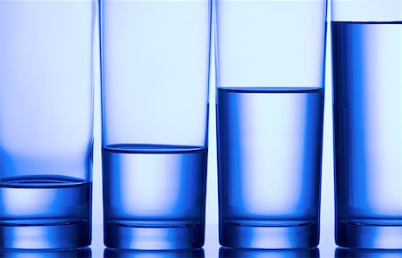 full glass of water - Close-up of four glasses of water in a row Stock Photo - Premium Royalty-Free, Code: 640-01355779