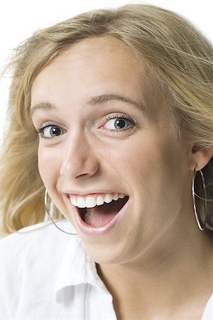 ear jewelry for women - Close-up of a young woman smiling Stock Photo - Premium Royalty-Free, Code: 640-01355821