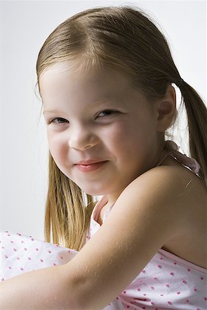 Close-up of a girl smiling Stock Photo - Premium Royalty-Free, Code: 640-01355836