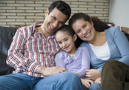 simsearch:640-01356582,k - Portrait of parents and their daughter on a couch Stock Photo - Premium Royalty-Free, Code: 640-01355840