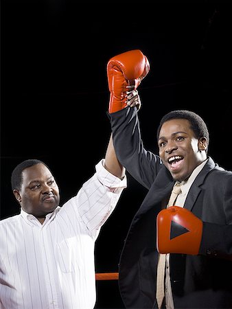 Referee declaring the winner of a boxing match Foto de stock - Sin royalties Premium, Código: 640-01355870