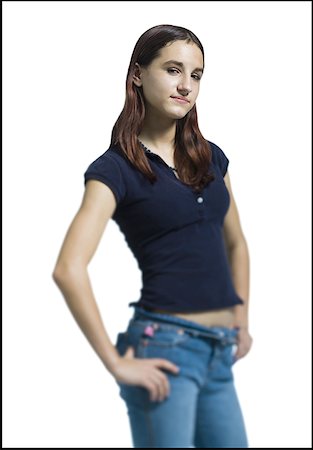 Portrait of a young woman standing with his hands on his hips Stock Photo - Premium Royalty-Free, Code: 640-01355978
