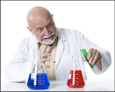 simsearch:640-01354976,k - Close-up of a male scientist pouring liquid from a test tube into a conical flask Foto de stock - Sin royalties Premium, Código: 640-01356008
