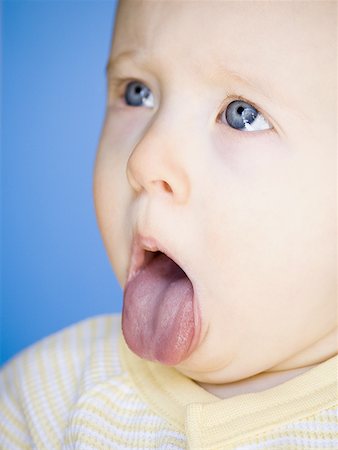 Baby Sticking Tongue Out Stock Photo - Premium Royalty-Free, Code: 640-01356185
