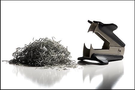 staple - Staple remover with pile of staples Foto de stock - Sin royalties Premium, Código: 640-01356187