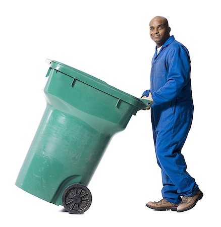 Garbage man with recycling bin Stock Photo - Premium Royalty-Free, Code: 640-01356190
