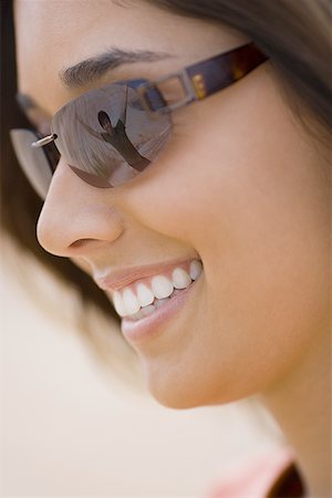 simsearch:700-00161547,k - Close-up of a young woman wearing sunglasses Stock Photo - Premium Royalty-Free, Code: 640-01356204