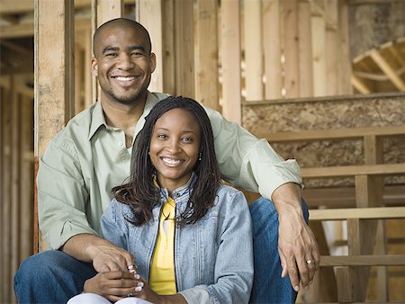 pictures people sitting front steps house - Portrait of a young couple sitting and smiling Stock Photo - Premium Royalty-Free, Code: 640-01356200