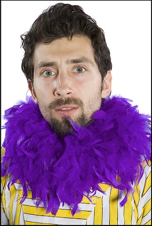 simsearch:640-01360385,k - Portrait of a young man wearing a feather boa Stock Photo - Premium Royalty-Free, Code: 640-01356243