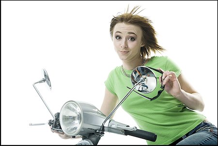 photograph motorcycle in studio - Portrait of a teenage girl riding a scooter Stock Photo - Premium Royalty-Free, Code: 640-01356420