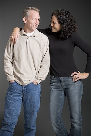 simsearch:640-01356582,k - Mid adult couple standing together and smiling Stock Photo - Premium Royalty-Free, Code: 640-01356559