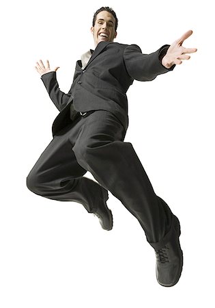 excited jumping suit - Low angle view of a businessman jumping Stock Photo - Premium Royalty-Free, Code: 640-01356553