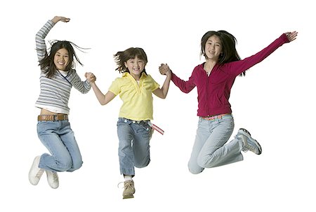 simsearch:640-01354438,k - Portrait de trois jeunes filles sautant Photographie de stock - Premium Libres de Droits, Code: 640-01356567