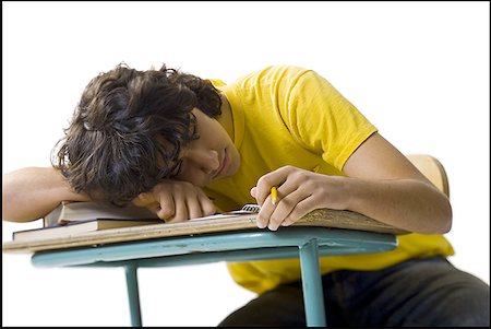 Close-up of a teenage boy sleeping on a desk Foto de stock - Sin royalties Premium, Código: 640-01356617