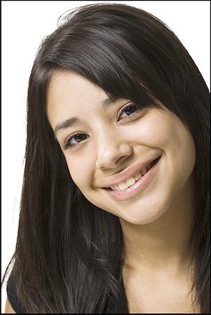 Portrait of a young woman smiling Stock Photo - Premium Royalty-Free, Code: 640-01356782