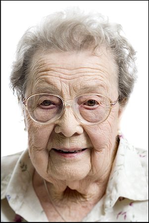 Portrait of a senior woman smiling Stock Photo - Premium Royalty-Free, Code: 640-01356792