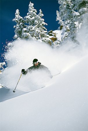 simsearch:640-01362181,k - Downhill skier skiing on mountain Foto de stock - Sin royalties Premium, Código: 640-01356841