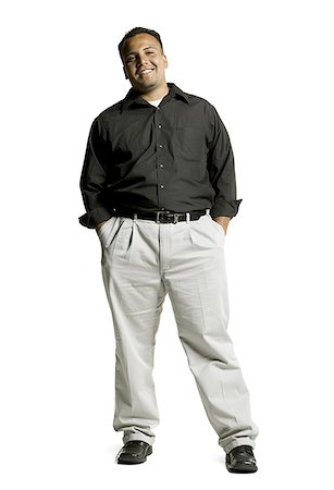 simsearch:640-01351214,k - Portrait of a young man standing with his hands in his pockets Stock Photo - Premium Royalty-Free, Code: 640-01356870