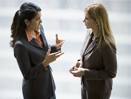 Two businesswomen talking Stock Photo - Premium Royalty-Free, Code: 640-01356892