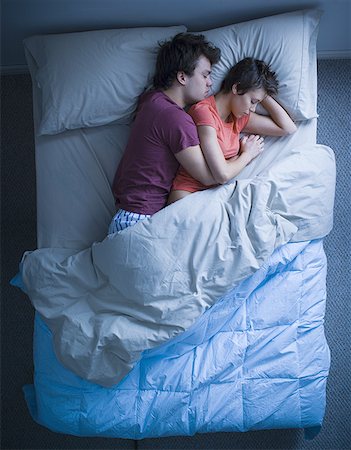 sleeping bed full body - Man and woman snuggling in bed asleep Stock Photo - Premium Royalty-Free, Code: 640-01356915