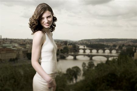 Portrait of a young woman smiling Fotografie stock - Premium Royalty-Free, Codice: 640-01356939