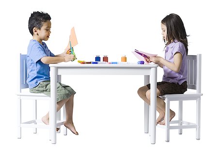 simsearch:640-02772735,k - Boy and girl sitting at table doing crafts Stock Photo - Premium Royalty-Free, Code: 640-01356945