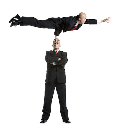 Two male acrobats in business suits performing Foto de stock - Sin royalties Premium, Código: 640-01356978